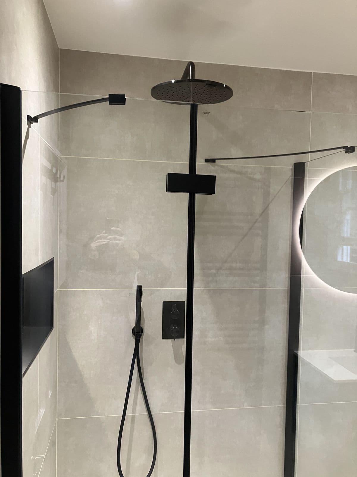 Completed bathroom renovation - walk-in shower with glass screen