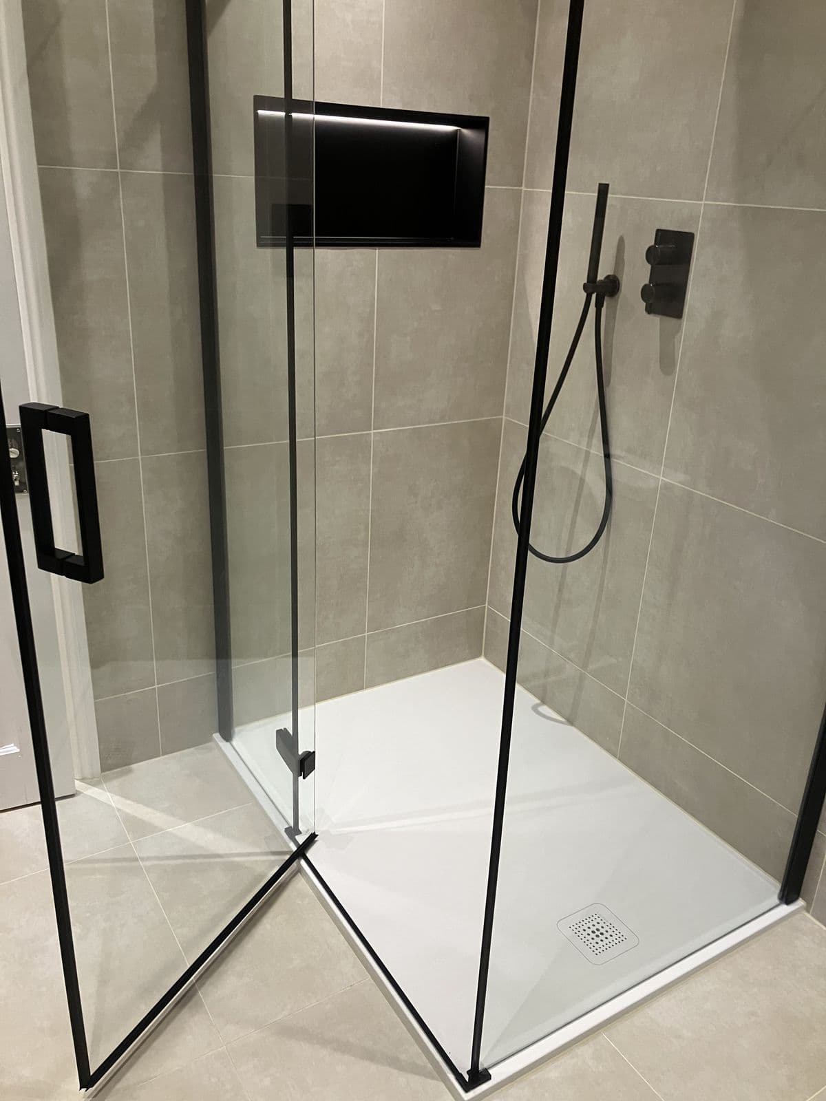Completed bathroom renovation - shower enclosure with rainfall shower head