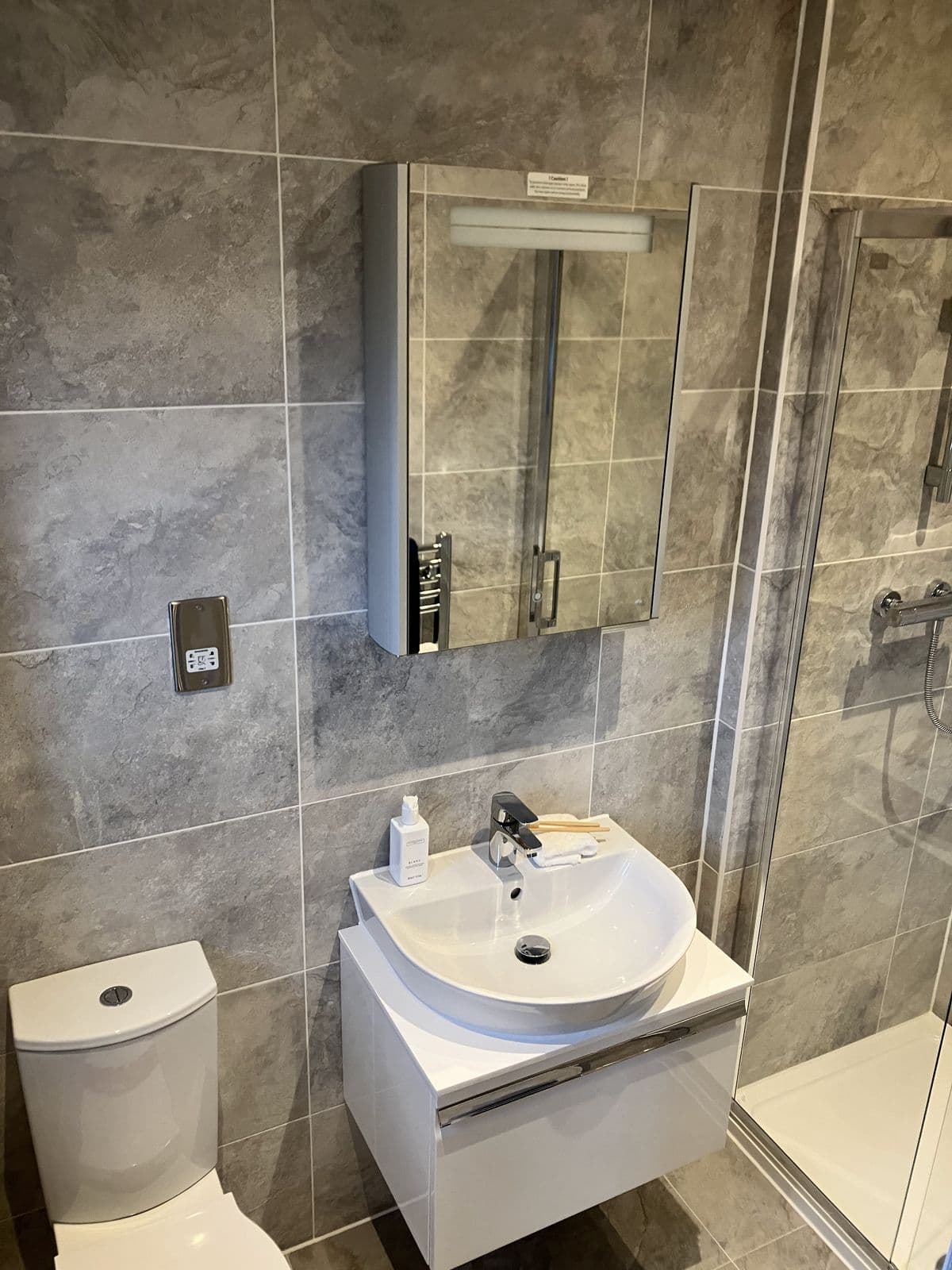 Completed bathroom renovation - mirrored bathroom storage cabinet