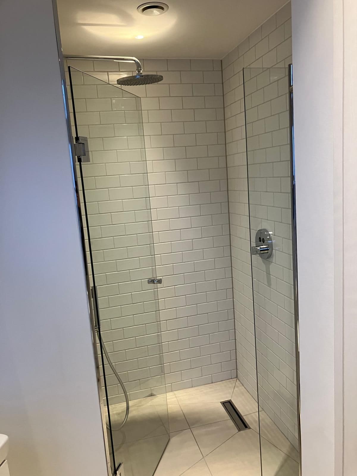 London bathroom refurbishment - recessed shower niche with feature tiling