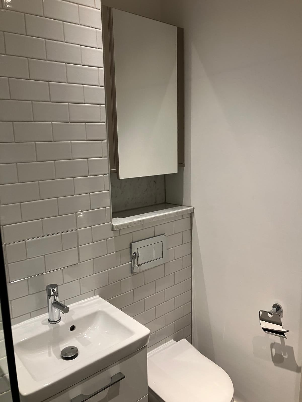 London bathroom refurbishment - tiled splashback and chrome fittings