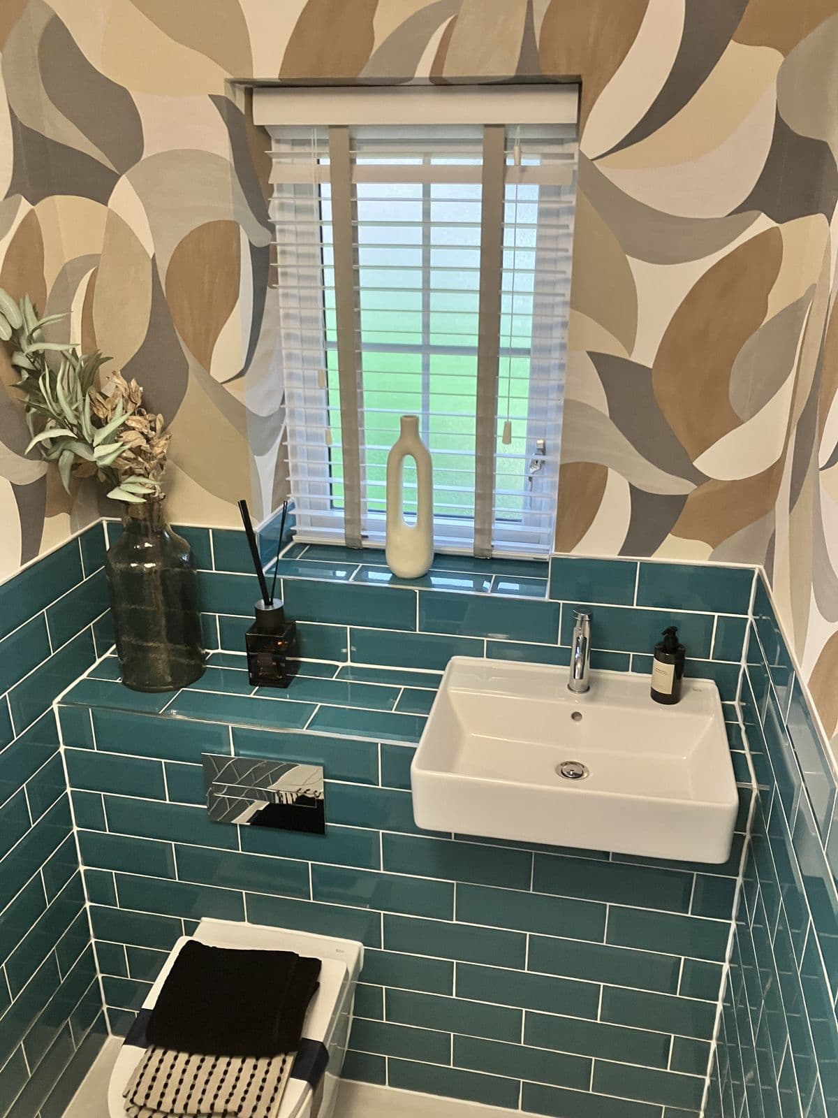 Bathroom renovation detail - freestanding bathtub and tiled surround
